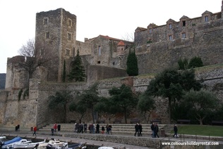 Visitors walking around the Royal Palace in Colioure